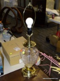 (R3) CRYSTAL TABLE LAMP; CUT CRYSTAL TABLE LAMP WITH A POLISHED BRASS BASE AND CAP. COMES WITH HARP