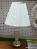 (BWALL) TABLE LAMP; CUT CRYSTAL TABLE LAMP WITH A POLISHED BRASS BASE AND A WHITE COOLIE SHADE.
