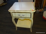 (R4) FRENCH PROVINCIAL SIDE TABLE; CREAM PAINTED, SINGLE DRAWER SIDE TABLE WITH A LOWER SHELF AND