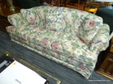 (R1) ADAMS PIERCE SOFA; FLORAL UPHOLSTERED, ROLL ARM 3-CUSHION SOFA WITH 2 THROW PILLOS AND A SKIRT.