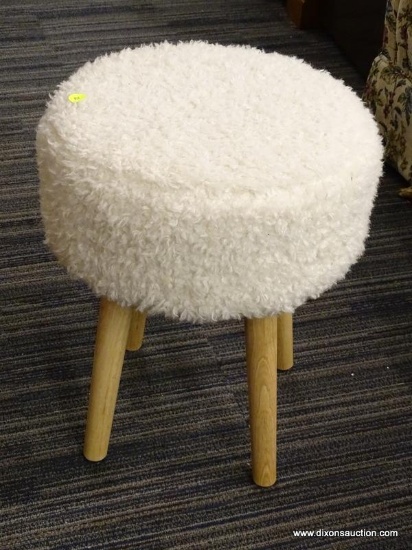 (R1) THRESHOLD STOOL; WHITE FAUX FUR UPHOLSTERED STOOL WITH BLONDE WOODEN TAPERED POLE LEGS.