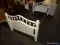 (R3) TWIN SIZE BED; WHITE PAINTED, TWIN SIZE BED WITH A BANNISTER, ARCHED BACK. MEASURES 42