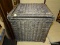 (R4) WICKER HAMPER; GRAY FINISHED WICKER HAMPER WITH A FABRIC LINED INTERIOR. MEASURES 17