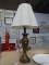(SHELVES) URN SHAPED TABLE LAMP; METAL TABLE LAMP WITH AN ANTIQUE BRASS FINISH AND A HAMMERED LIKE