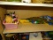 (SHELVES) SHELF LOT OF TOYS; LOT TO INCLUDE A GROOT MASK, TOY GOLF CLUBS, A PLUSH BEARS, MINNIE
