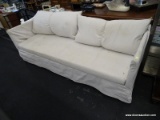 (R3) IKEA BOMSUND SOFA; METAL FRAMED SOFA WITH A BEIGE SLIPCOVER, A BENCH CUSHION, AND 2 BAKC REST