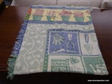 (R3) DECORATIVE BLANKET WITH A GARDENING PATTERN AND FRINGES ON ALL SIDES.
