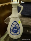 (R3) JIM BEAM MILK GLASS DECANTER WITH BLUE SAILBOAT SCENE ON ONE SIDE. MARKED ON BOTTOM #D-334.