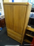 (R3) ENTERTAINMENT ARMOIRE; OAK ARMOIRE WITH 2 CABINET DOORS OPENING TO REVEAL A REMOVABLE SHELF AND