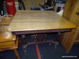 (R4) VICTORIAN KITCHEN TABLE; EAST LAKE STYLE OAK KITCHEN TABLE WITH A LEAF AND SCROLLING DETAILED