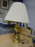 (SHELVES) TABLE LAMP; POLISHED BRASS TABLE LAMP WITH A CREAM FABRIC COOLIE SHADE. MEASURES 24.5