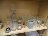 (SHELVES) LOT OF ASSORTED GLASSWARE; SHELF LOT TO INCLUDE WINE GLASSES, MUGS, ROCKS GLASSES, AND