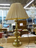 (SHELVES) TABLE LAMP; POLISHED BRASS, TURNED TABLE LAMP WITH A VINTAGE FABRIC COOLIE SHADE. MEASURES