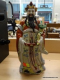 (SHELVES) ORIENTAL FIGURINE; PORCELAIN ORIENTAL FIGURINE OF A KING WEARING A CROWN AND HOLDING WHAT