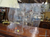 (R2) SET OF GLASS CHIMNEYS; 4 PIECE SET OF CLEAR GLASS, 16