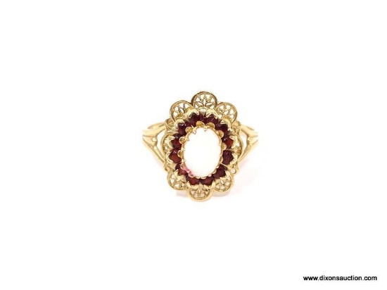 ELEGANT 10K YELLOW GOLD FILIGREE STATEMENT RING. FEATURES A BEAUTIFUL CENTER OPAL SURROUNDED BY