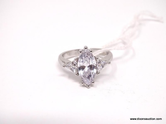 .925 STERLING SILVER OVER COPPER STATEMENT RING. FEATURES A BEAUTIFUL MARQUISE CUT CZ ACCOMPANIED BY