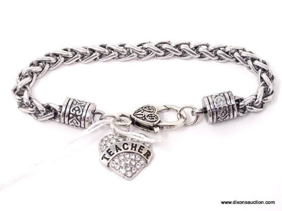 STAINLESS STEEL BRACELET WITH CZ SET HEART SHAPED "TEACHER" CHARM. MEASURES APPROX. 8-1/2" LONG.