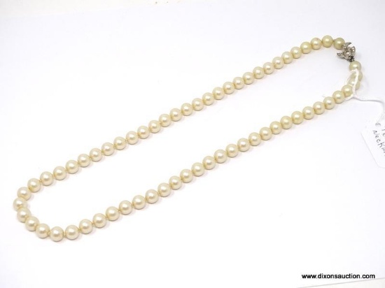 VINTAGE STRAND OF PEARLS WITH UNIQUE SILVER TONED CZ SET CLASP. MEASURES APPROX. 24" LONG.