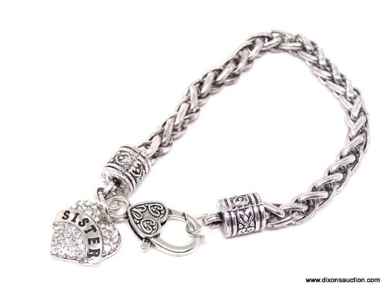 STAINLESS STEEL BRACELET WITH CZ SET HEART SHAPED "SISTER" CHARM. MEASURES APPROX. 8-1/2" LONG.