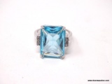 .925 STERLING SILVER OVER COPPER LADIES 8 CT BLUE TOPAZ RING. SIZE 7 1/2.