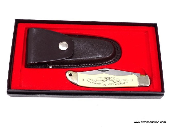 SCHRADE SCRIMSHAW LOCKBLADE 5 1/4" CLOSED FOLDING HUNTER WITH A HIGH CARBON STEEL CLIP BLADE. THE