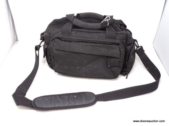 REDHEAD BLACK MULTI-POCKET GUN/FISHING BAG WITH CONVENIENT CARRYING HANDLES AND SHOULDER STRAP.
