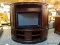 LARGE MAHOGANY 2-PIECE DEMI-LUNE ENTERTAINMENT CABINET WITH BURLD MAHOGANY SLIDING DOORS. MEASURES