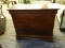 MAHOGANY THREE DRAWER NIGHTSTAND WITH SHIELD STYLE PULLS. HIDDEN DRAWER AT THE TOP. TOP DOES HAVE A