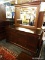 MAHOGANY 6 DRAWER DOUBLE DRESSER WITH BEVELED MIRROR AND SHIELD STYLE PULLS. SIX DRAWERS ARE NORMAL