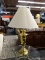ONE OF A PAIR OF BRASS TROPHY STYLE TABLE LAMPS WITH SHADE. 29