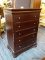 (R3) CHARLISLE COLLECTION DARK WOOD FIVE DRAWER TALL CHEST WITH SHIELD STYLE PULLS. PART OF A 5 PC.