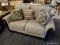 (R4) ASHLEY FURNITURE CONTEMPORARY BLACK WOOD TAUPE UPHOLSTERED LOVESEAT. MODEL #335035. COMES WITH