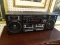 (R4) SANYO AM/FM DOUBLE CASSETTE STEREO. MODEL #C35. COMES WITH A DETACHABLE SPEAKERS ON EACH SIDE,
