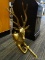 1 OF A PAIR BRASS RUSTING 6 POINT DEER. WITH A VERY ORNATE NECK. MEASURES 22 IN LONG. 5 IN WIDE.