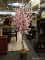 APPROX 6 FOOT TALL ARTIFICAL CHERRY BLOSSOM TREE IN A WICKER POT.