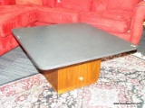 MID-CENTURY MODERN WALNUT SQUARE BASE COFFE TABLE WITH GRANITE SQUARE TOP AND ROUNDED EDGES.