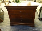 MAHOGANY THREE DRAWER NIGHTSTAND WITH SHIELD STYLE PULLS. HIDDEN DRAWER AT THE TOP. TOP DOES HAVE A