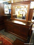 MAHOGANY 6 DRAWER DOUBLE DRESSER WITH BEVELED MIRROR AND SHIELD STYLE PULLS. SIX DRAWERS ARE NORMAL