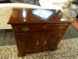 CHERRY CHIPPENDALE LIFT TOP BAR. 1 DRAWER OVER 2 DOORS. MEASURES APPROX. 36.5