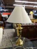 ONE OF A PAIR OF BRASS TROPHY STYLE TABLE LAMPS WITH SHADE. 29
