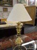 ONE OF A PAIR OF BRASS TROPHY STYLE TABLE LAMPS WITH SHADE. 29