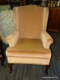 ONE OF A PAIR OF QUEEN ANNE WING CHAIRS DUSTY ROSE COLORED.