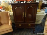 HOOKER FURNITURE CHERRY QUEEN ANNE TV ARMOIRE WITH BRASS PULLS. MEASUREES APPROX. 35