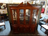 MAHOGANY CHIPPENDALE 2-PIECE BREAK FRONT. LIGHTED HUTCH TOP WITH MIRRORED BCAK AND GLASS SHELVES.