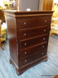 (R3) CHARLISLE COLLECTION DARK WOOD FIVE DRAWER TALL CHEST WITH SHIELD STYLE PULLS. PART OF A 5 PC.