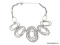 DESIGNER SIGNED, ERICA LYONS MODERNIST SILVER TONE HAMMERED SWIRL STATEMENT NECKLACE. FEATURES 7