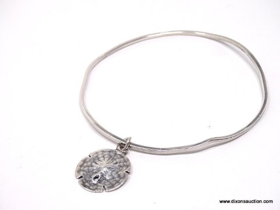 DESIGNER SIGNED, STERLING SILVER WAVY BANGLE BRACELET WITH STERLING SILVER SAND DOLLAR CHARM.