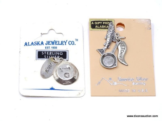 TWO VINTAGE STERLING SILVER BRACELET OR NECKLACE CHARMS FROM ALASKA. THE FIRST IS A GOLD MINER'S PAN