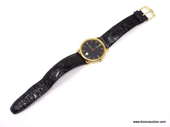 A FINE VINTAGE TITAN GENTLEMAN'S WATCH. FEATURES A SOPHISTICATED BLACK FACE WITH GOLD HOUR MARKERS